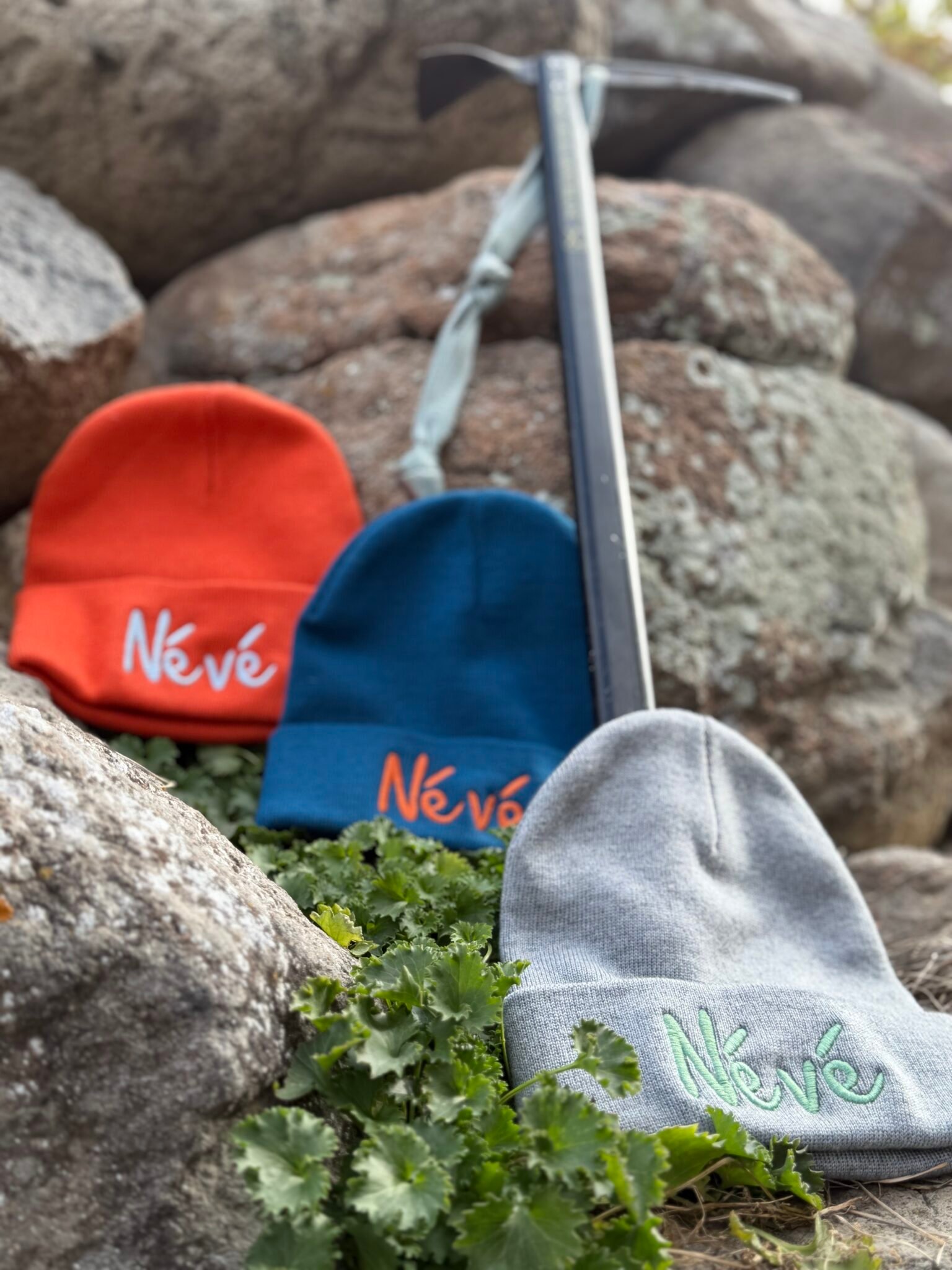 a selection of 3 beanies with Névé embroidered on them, from Gravity Rebel