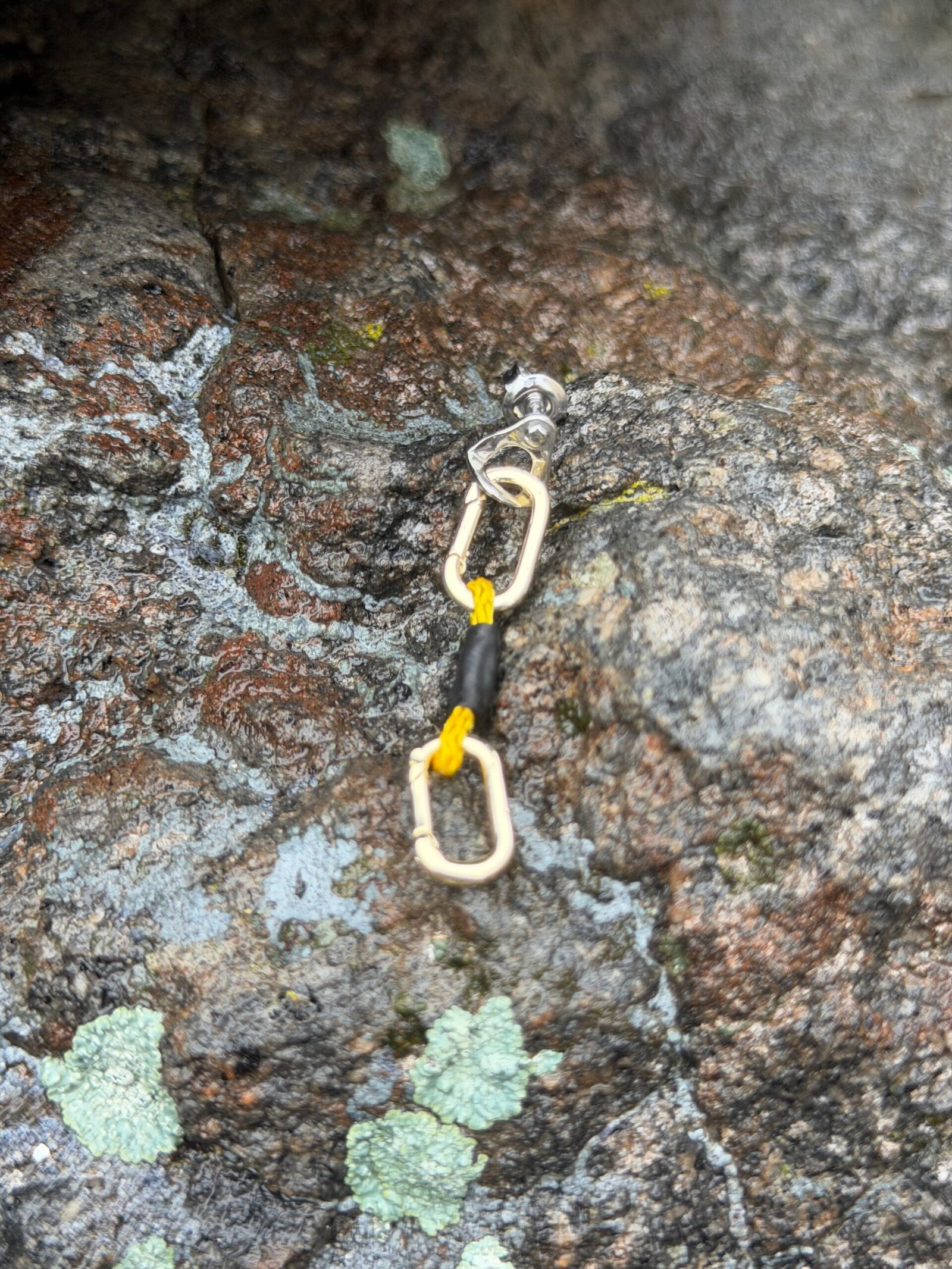 Silver climbing bolt earring with silver carabiner and yellow quickdraw